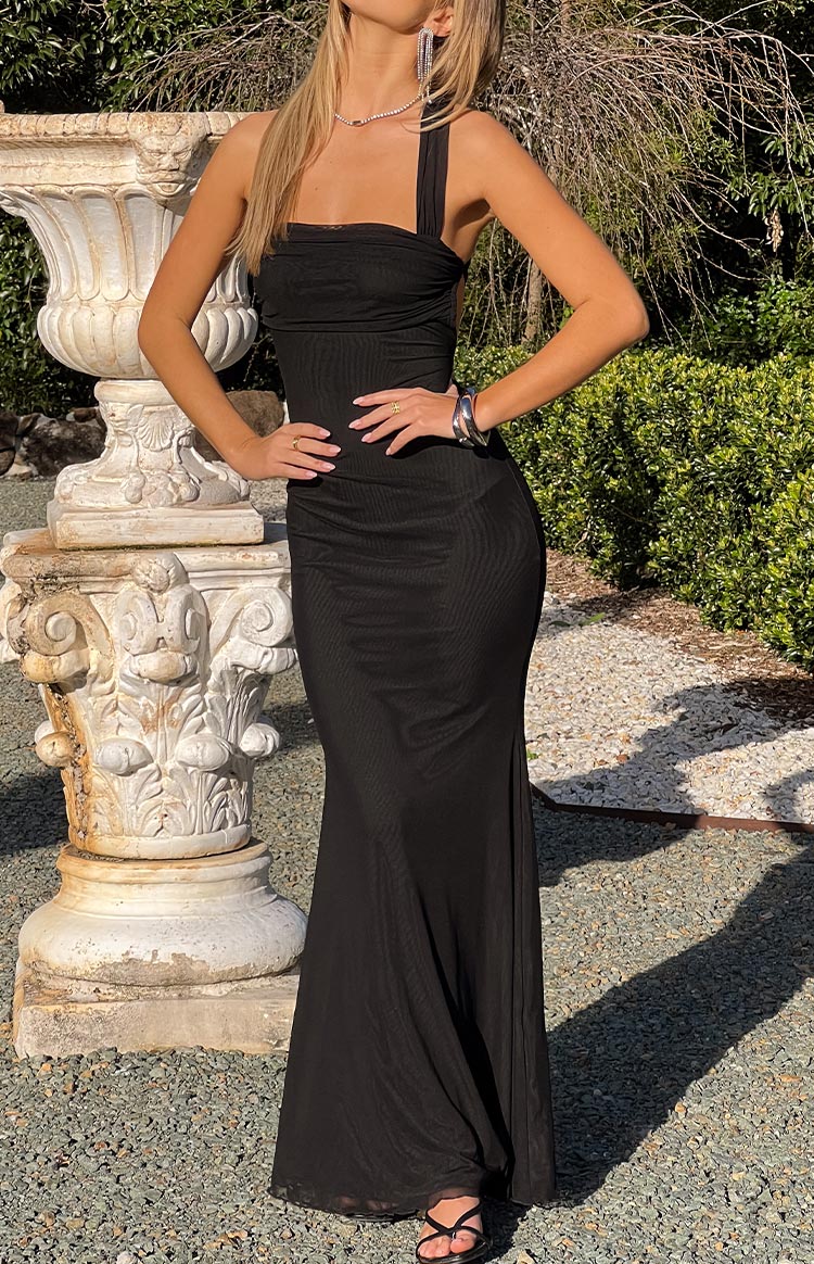 A sleek black mesh formal maxi dress with a fitted- ruched strapless bodice and a flowing skirt- perfect for a sophisticated event or prom.