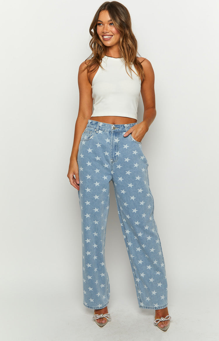 Beginning Boutique Eli Star Print Mid Wash Wide Leg Denim Jeans mid wash denim high-waisted wide leg jeans with white star print