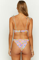 Back view of a painted floral bikini top with tie-up shoulder straps and a rose gold clasp closure, paired with matching high-cut bottoms