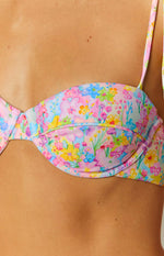 Close-up of the underwire and structured cup of a pastel painted floral bikini top