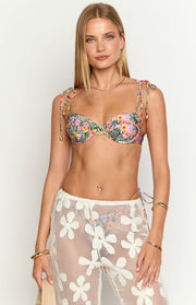 Front view of a tropical floral and zebra print bikini top with tie-up shoulder straps and underwire support