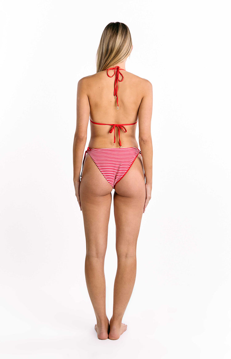 Rear view of red and white thin horizontal stripe tie bikini bottoms with a cheeky cut