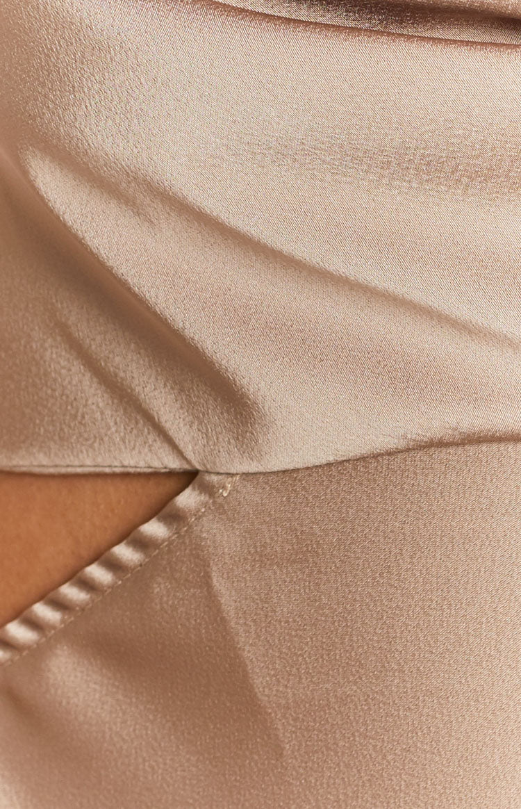 Mocha satin maxi dress close-up showing the fabric's subtle sheen and a precise side cutout detail