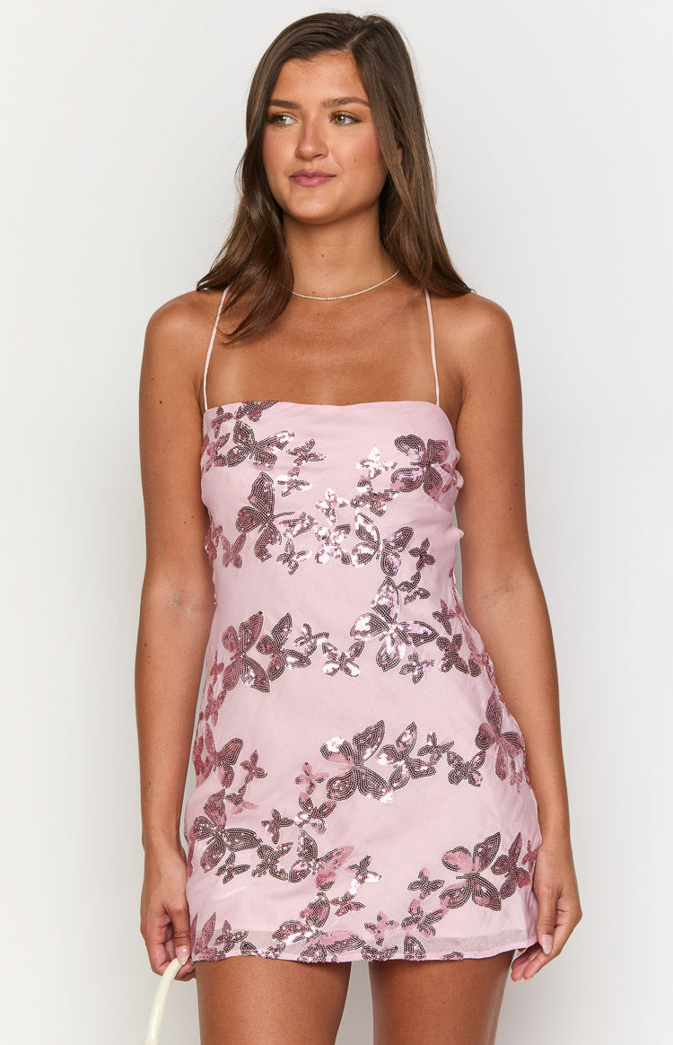 Close-up of the pink mini dress with iridescent butterfly sequins and thin spaghetti straps