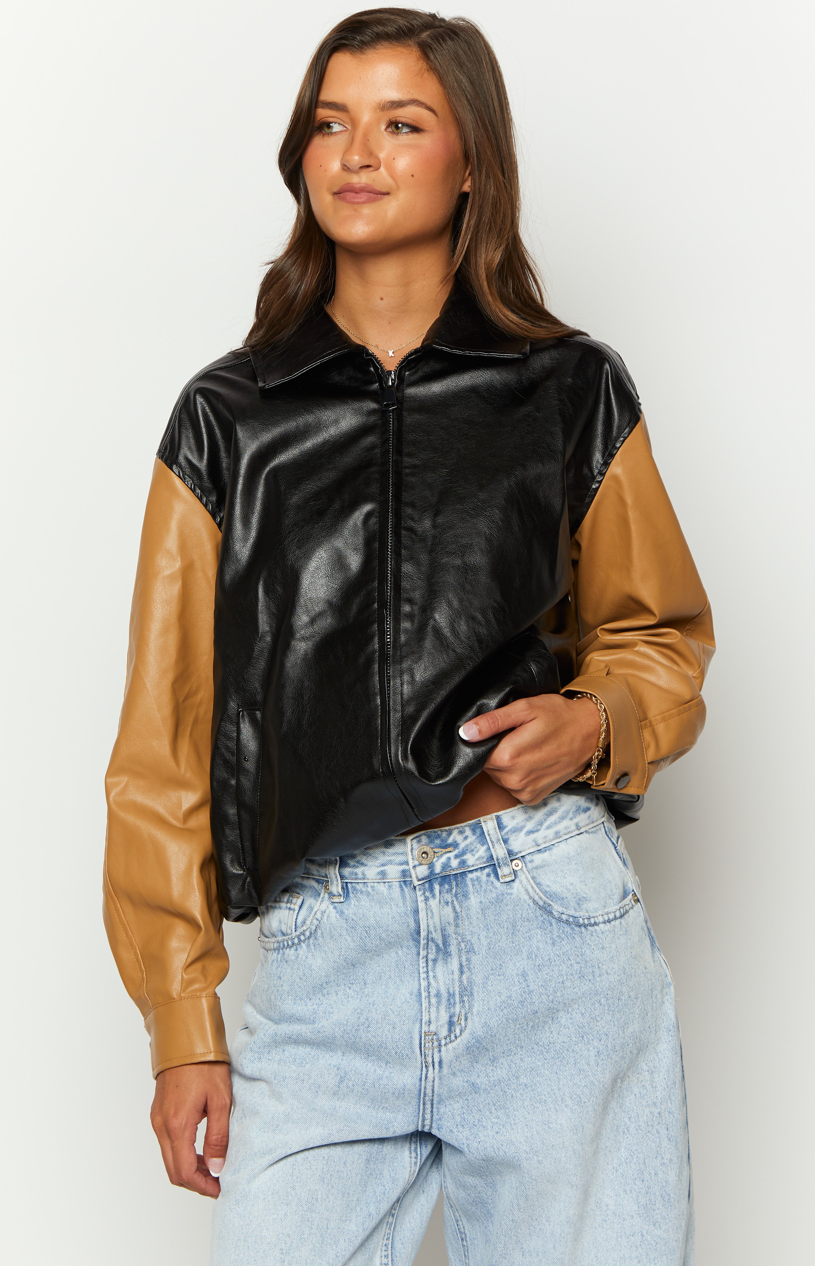 Black and tan PU bomber jacket featuring a pointed collar and full-length front zipper