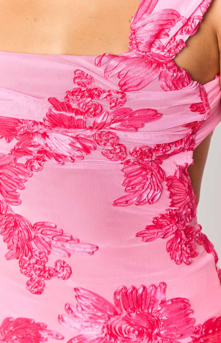 Close-up of the pink mesh mini dress with textured hot pink floral appliques and ruched details
