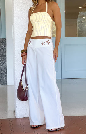 Beginning Boutique Alamara White Floral Detail Wide Leg Pants white wide leg pants with floral cutout detail on the waistband