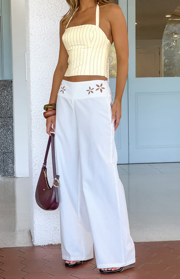 Beginning Boutique Alamara White Floral Detail Wide Leg Pants white wide leg pants with floral cutout detail on the waistband
