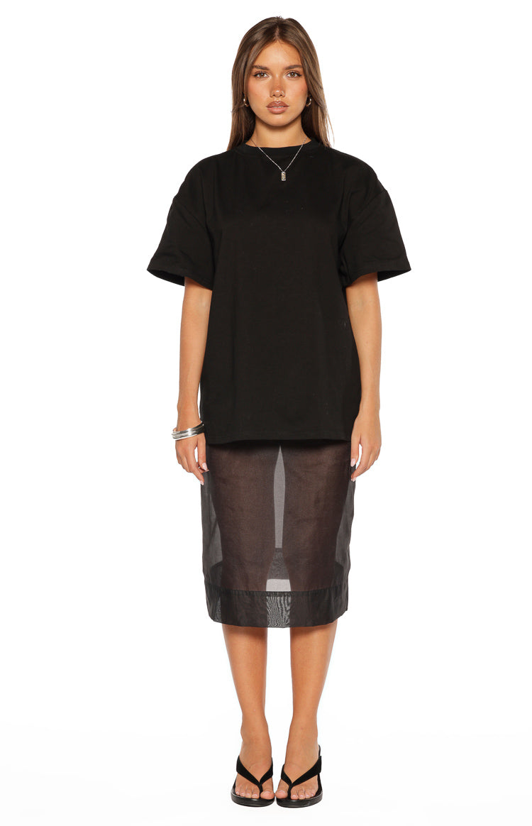 Oversized black tee with a crew neck, wide short sleeves, and a longline hem