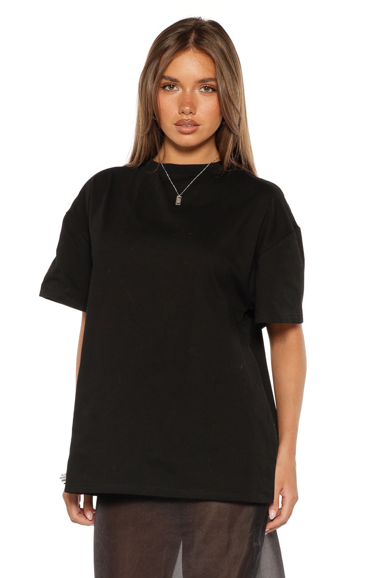 Front view of a black crew neck tee with relaxed short sleeves and a loose fit