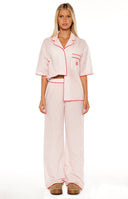 A close up of the Alexea Pink Stripe Pajama Pants showing the relaxed fit and soft fabric perfect for a luxurious night in.