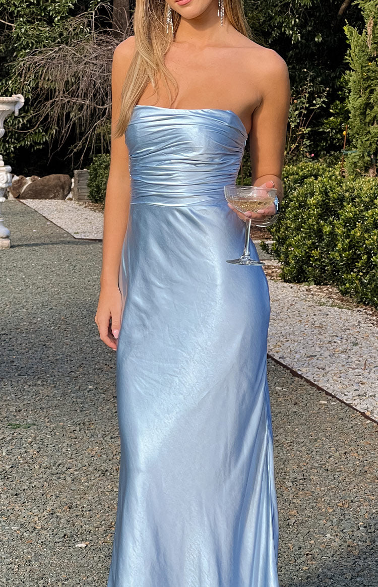 Close-up of the ruched strapless bodice and the shimmering blue satin fabric of the maxi dress