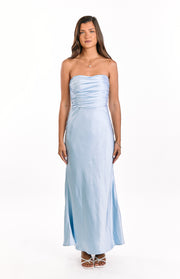 Front view of a light blue strapless maxi dress with a ruched bodice and flowing skirt