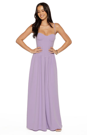 Model posing in a floor length lilac crepe maxi dress with a structured corset bodice suitable for a bridesmaid