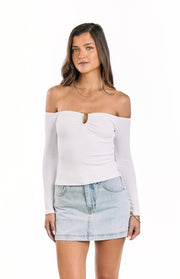 Front view of a white ribbed knit off-shoulder long sleeve top with a central ring detail and cutout