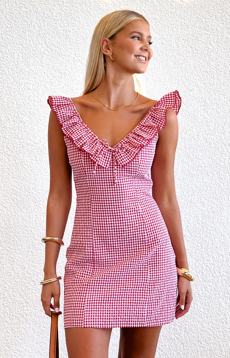 Red gingham fitted mini dress with a V-neckline, frill straps, and a tie detail at the bust