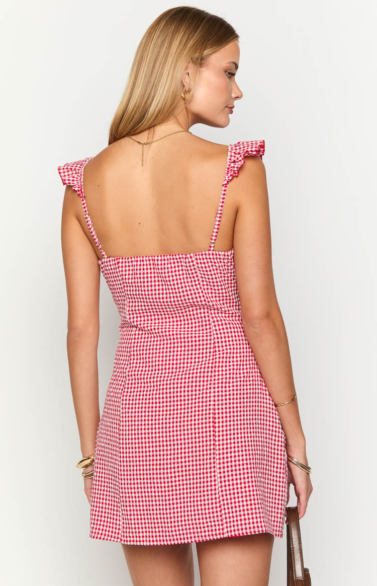 Rear view of a red gingham mini dress with a square back and frill shoulder straps