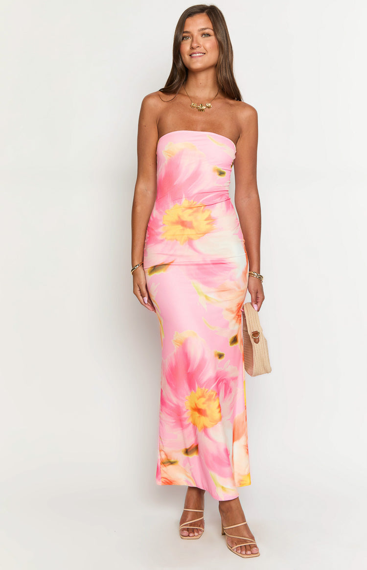 Front view of a pink and orange floral mesh maxi dress with a strapless neckline and ruched side detail