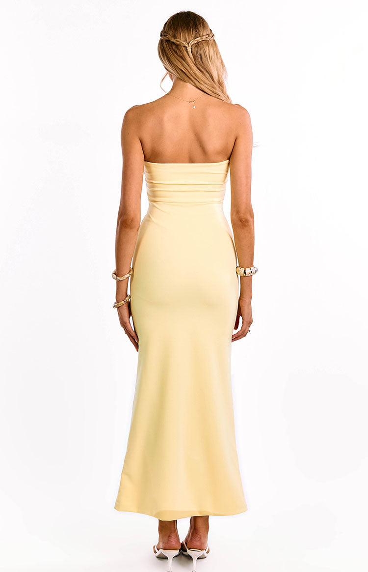 Rear view of a yellow crepe strapless maxi dress with a straight back and bodycon fit through the hips