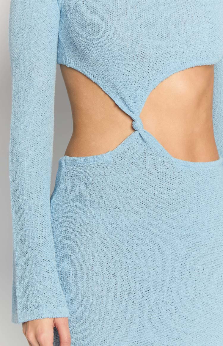 Close-up of the side cutout and knot detail on the light blue knit maxi dress