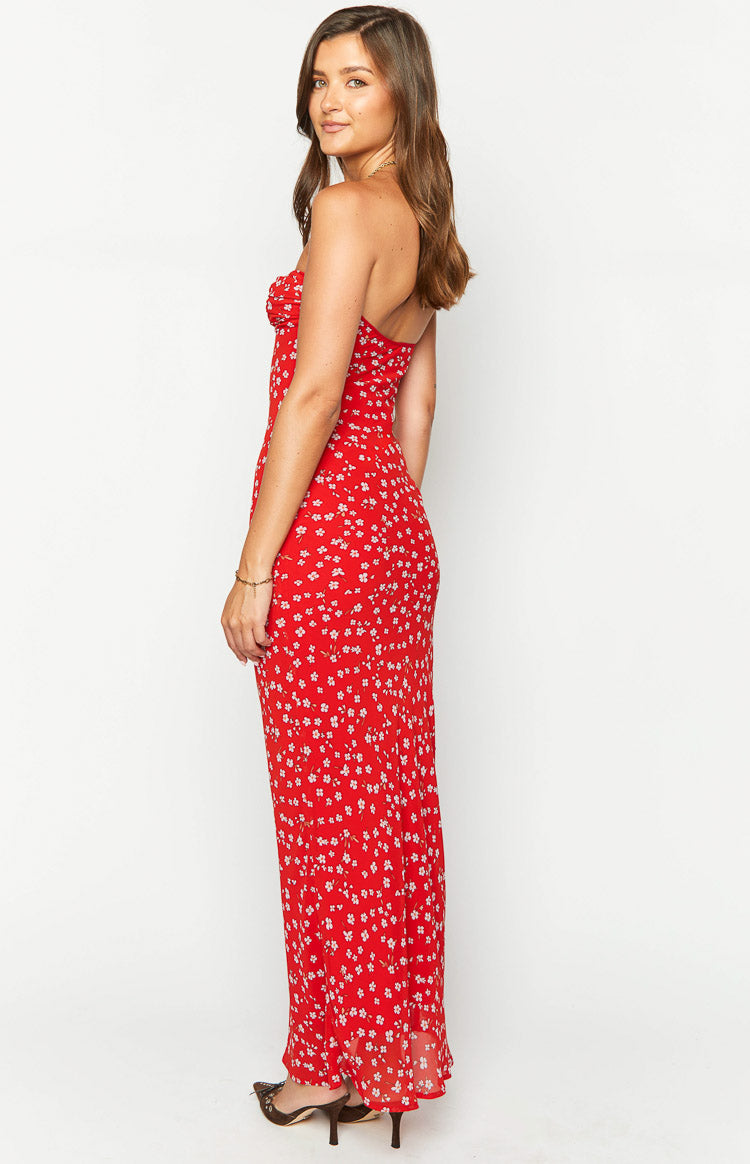 Side view of the red floral maxi dress with a strapless sweetheart neckline and a long, fitted silhouette