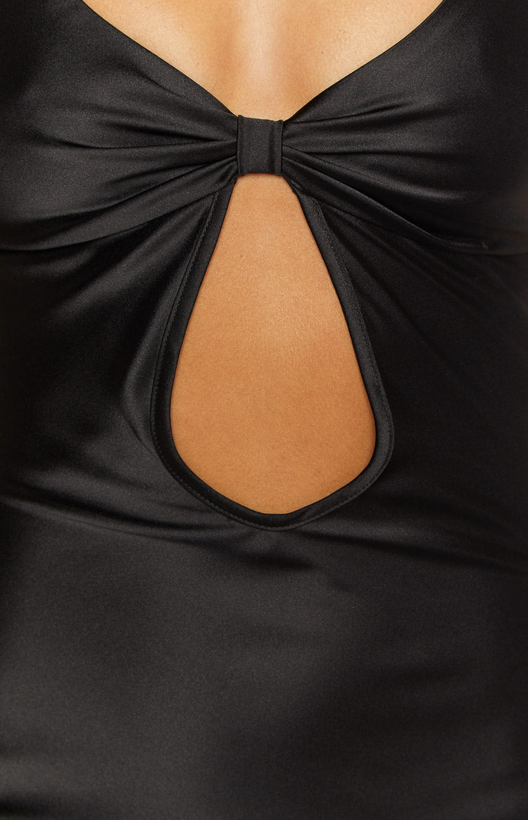 Close-up of the black satin dress with a twisted knot bust detail and keyhole cutout