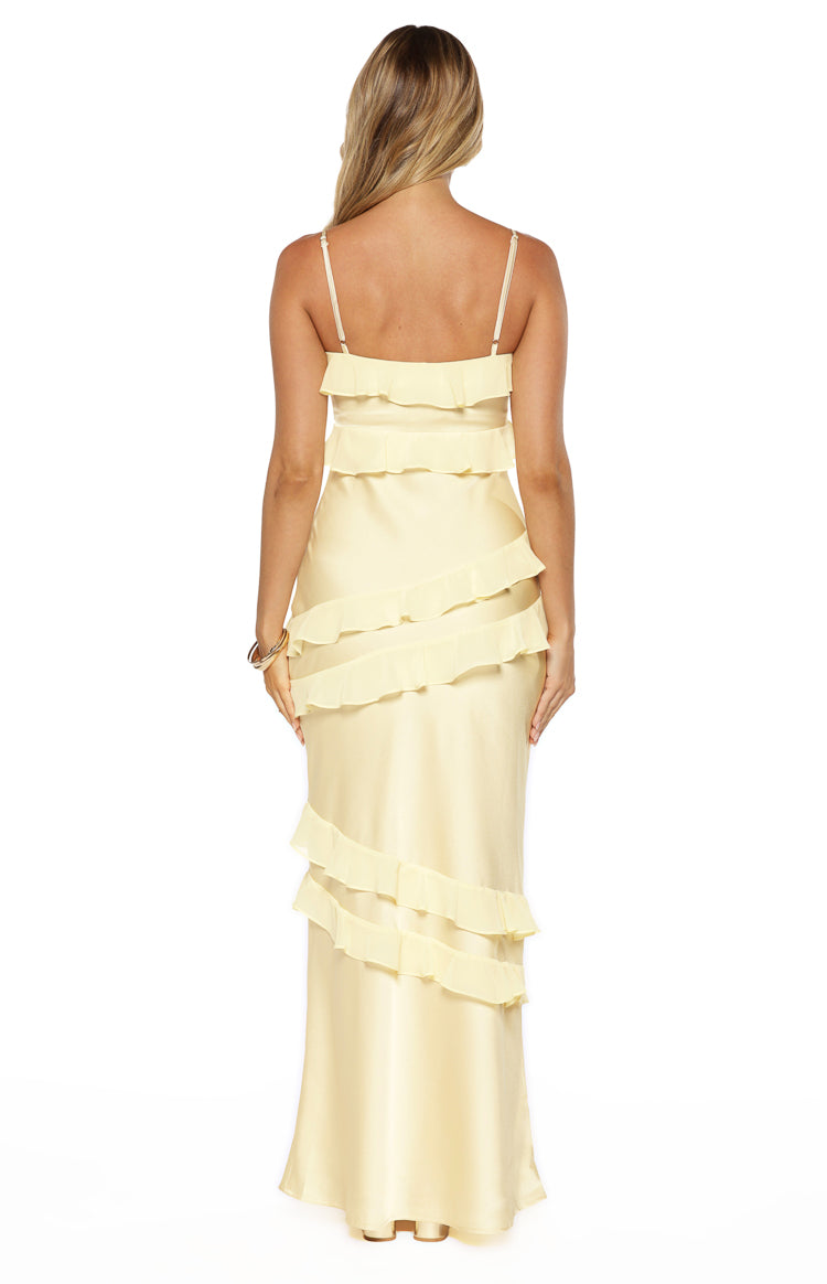 Rear view of a yellow satin maxi dress with tiered ruffles and thin spaghetti straps