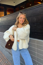 Cream chunky knit cardigan with oversized balloon sleeves and an open front