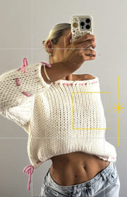 Beginning Boutique Bea Cream Sweater cream chunky knit wide neck cropped sweater with pink lacing details on shoulders and he