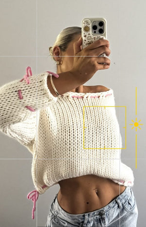 Beginning Boutique Bea Cream Sweater cream chunky knit wide neck cropped sweater with pink lacing details on shoulders and he
