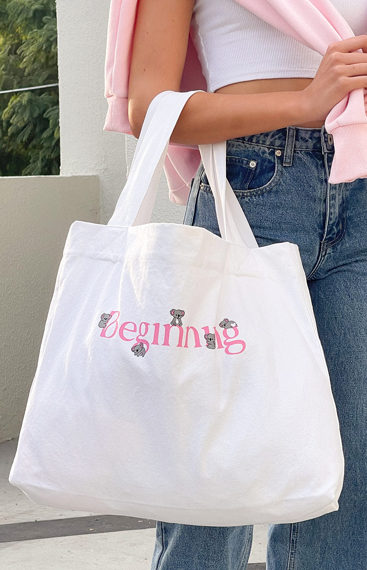 Beginning Boutique Koala Tote Bag white canvas tote bag with pink Beginning text and grey koala graphics