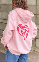 Beginning Boutique Beginning Pink Lovey Bubble Hoodie light pink oversized hoodie with a hood, long sleeves, and a pink heart