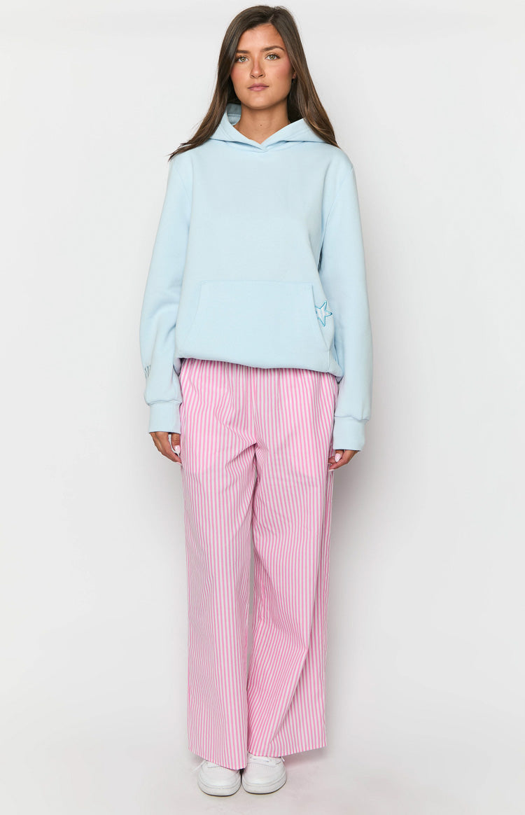 Light blue oversized hoodie with a kangaroo pocket and an embroidered star outline