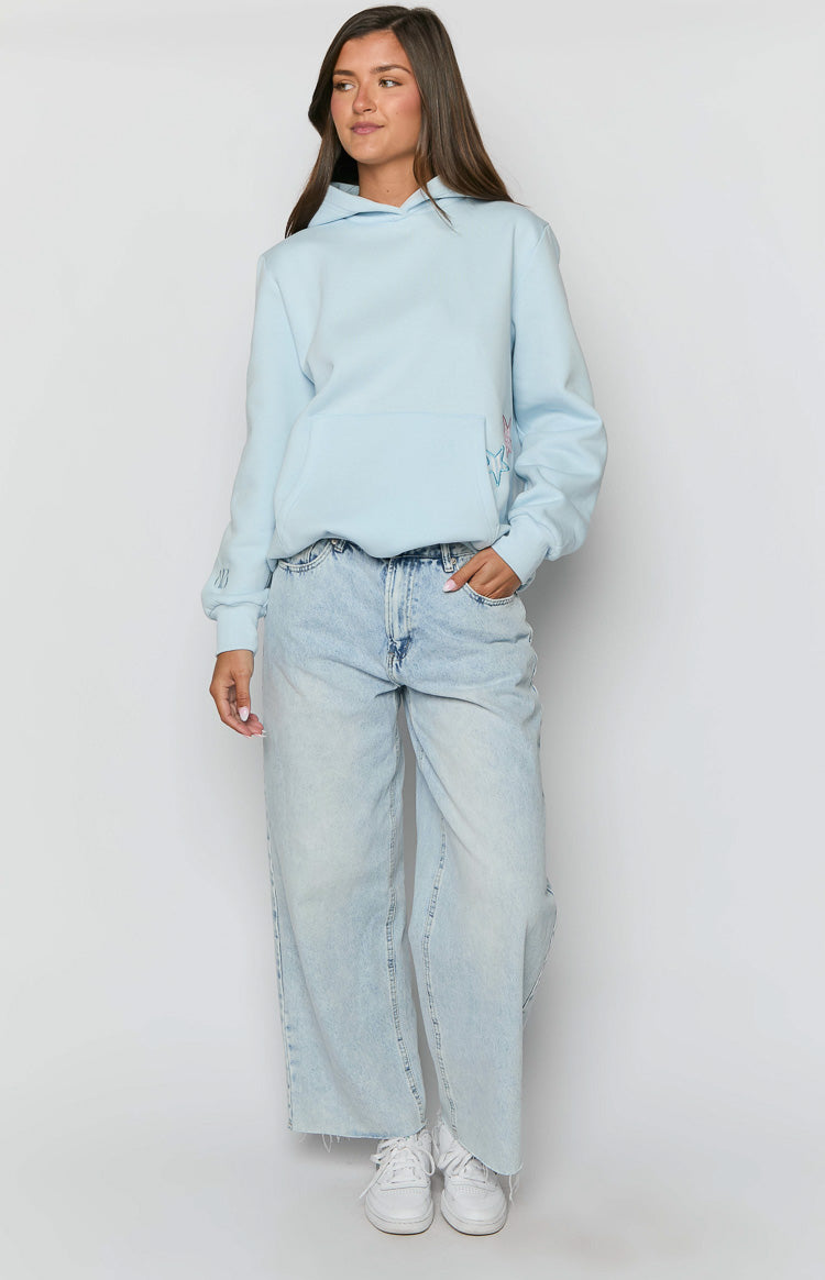Light blue hoodie with a front kangaroo pocket, pink and blue star outline, and BB logo on cuff