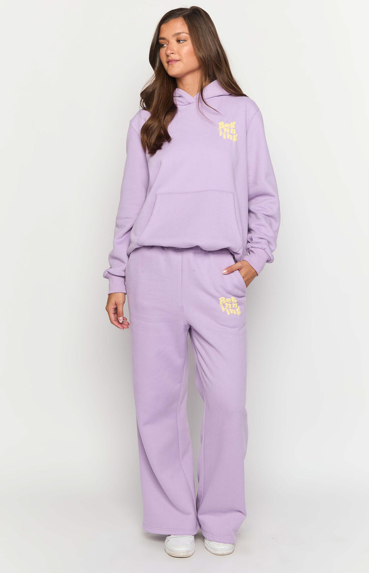 Purple relaxed fit wide-leg track pants with an elasticated waist and yellow logo on the left thigh
