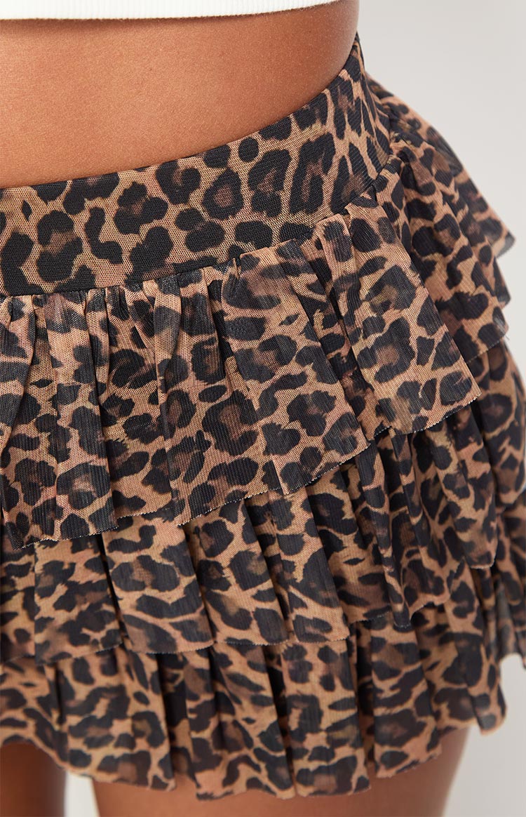 Close-up of the sheer leopard print fabric and multiple ruffled layers of the shorts