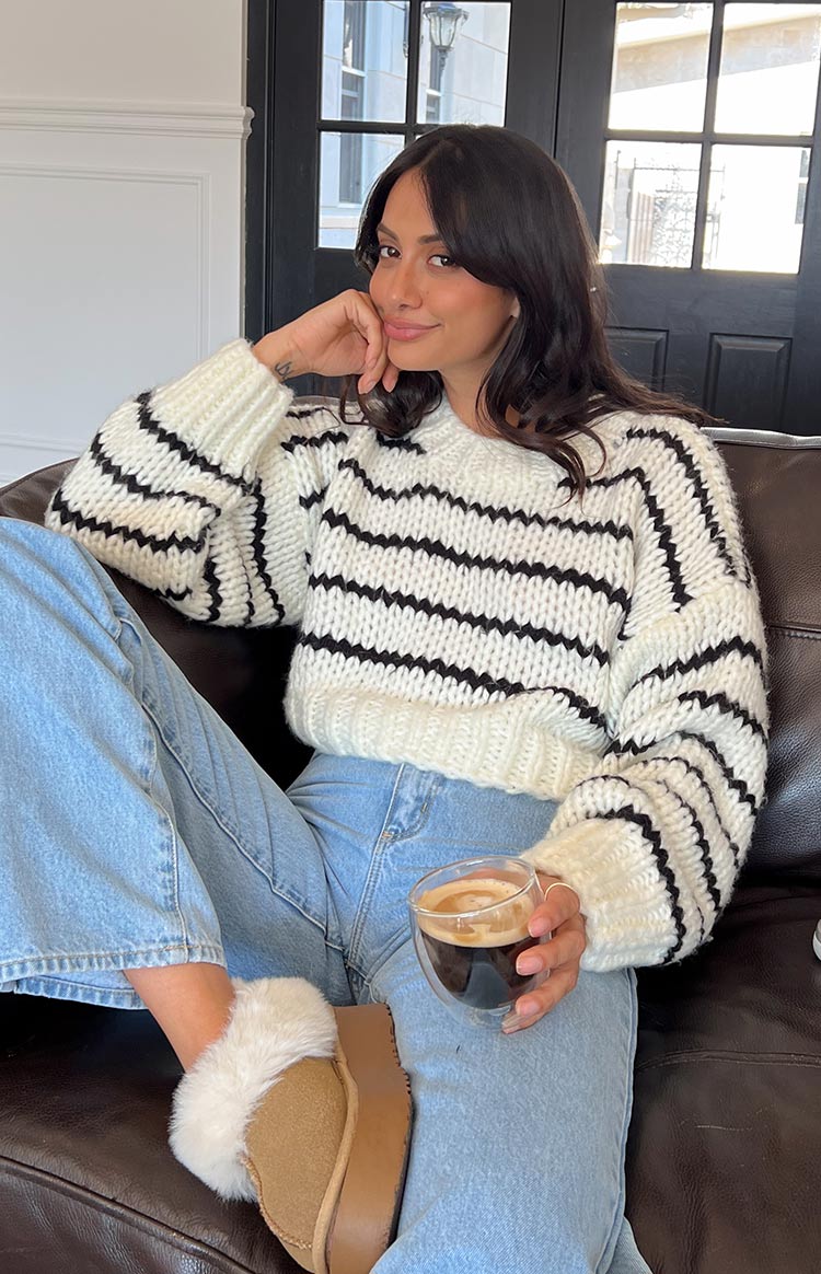 Relaxed fit white chunky knit sweater with black horizontal stripes and wide sleeves