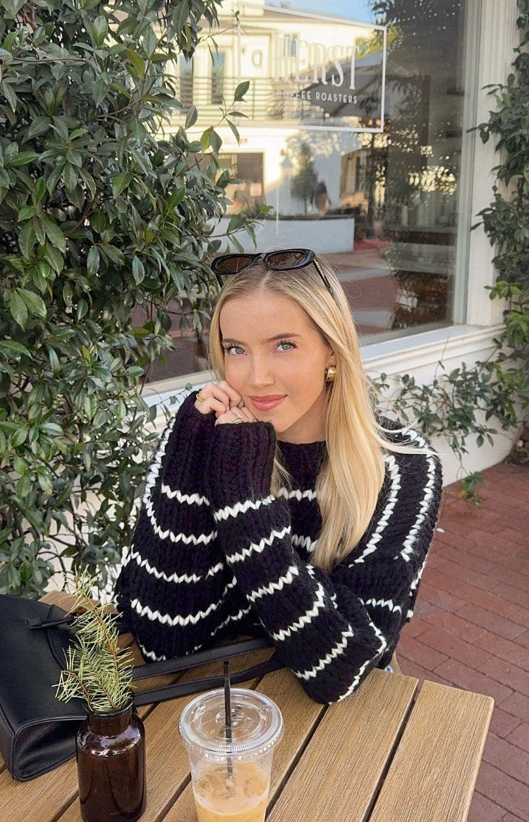 Beginning Boutique Belmont Black And White Striped Sweater black chunky knit sweater with wavy white stripes and crew neck