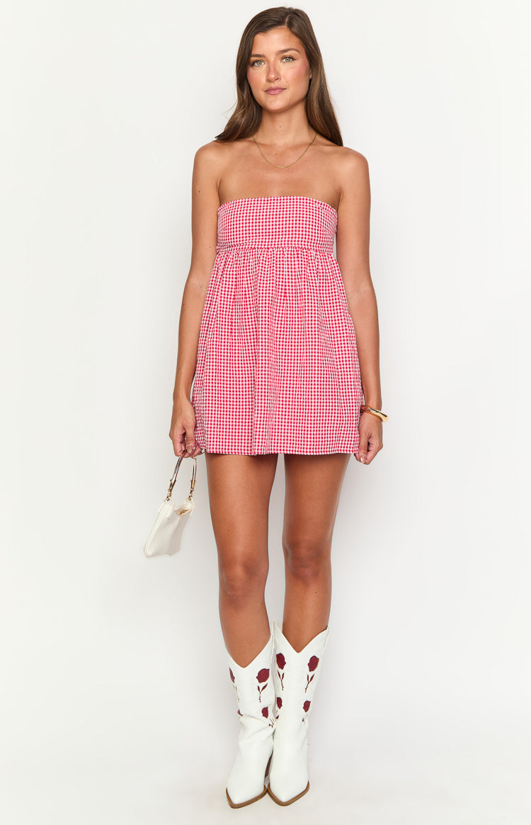 Front view of a red gingham strapless mini dress with a gathered bodice and a flowy A-line skirt