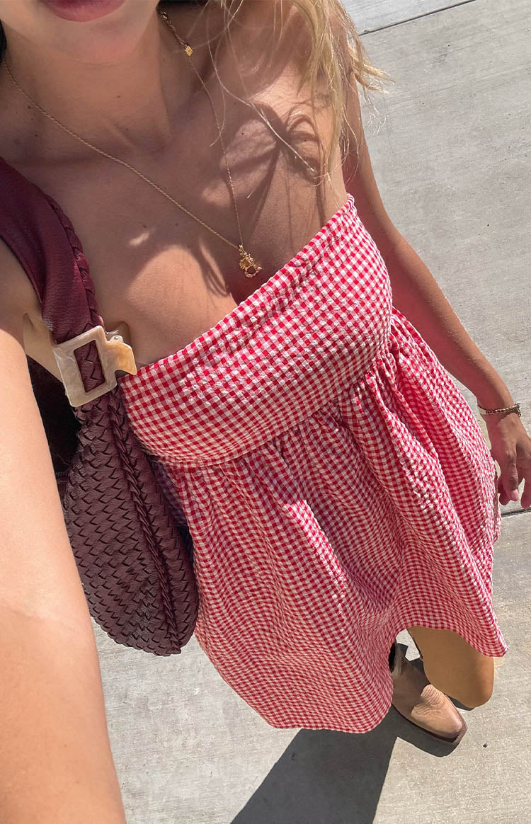 Beginning Boutique Berrie Red Gingham Strapless Mini Dress red and white gingham strapless mini dress with a shirred bust and flowy skirt