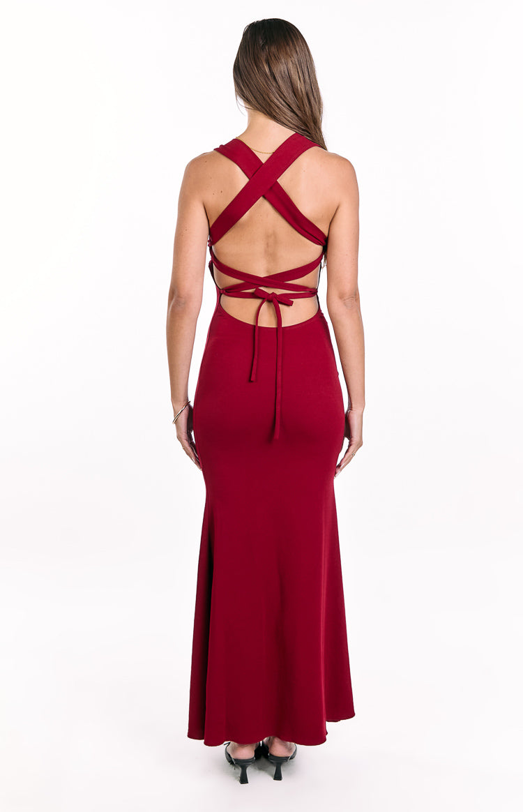 Rear view of a wine crepe maxi dress with criss-cross back straps, an open back, and a tie-back waist