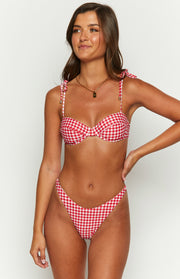 Front view of red and white gingham bikini bottoms with a high V-cut leg