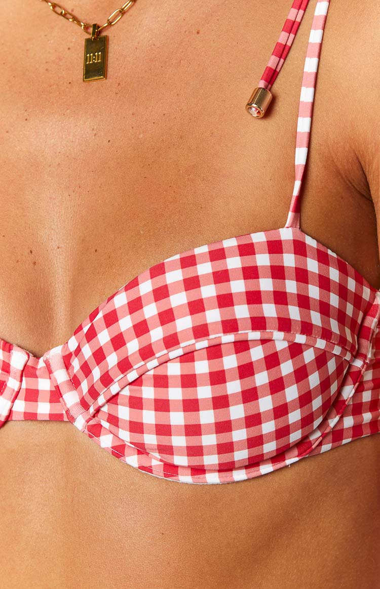 Close-up of the red and white gingham bikini top cup, showing the underwire and adjustable strap