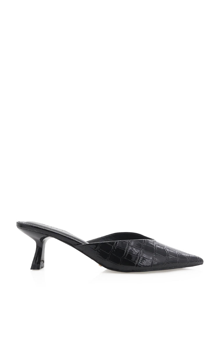 Side view of a black crocodile embossed mule heel with a pointed toe and flared kitten heel