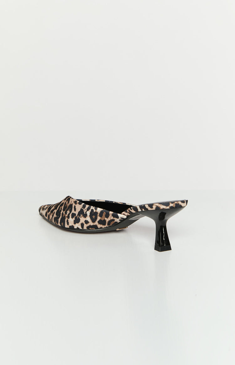 Side view of a leopard print pointed-toe mule heel with a glossy black flared kitten heel