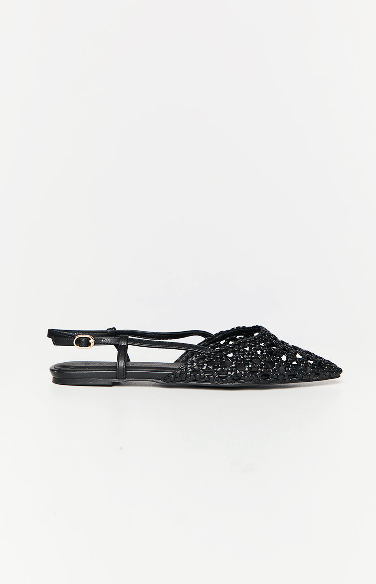 Side view of a black woven mule with a pointed toe and an adjustable slingback strap