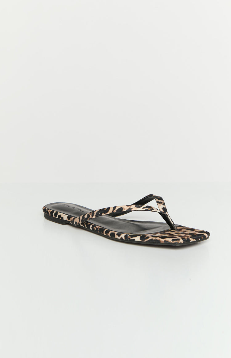 Side view of a single leopard print flat thong sandal with a square toe and thin straps