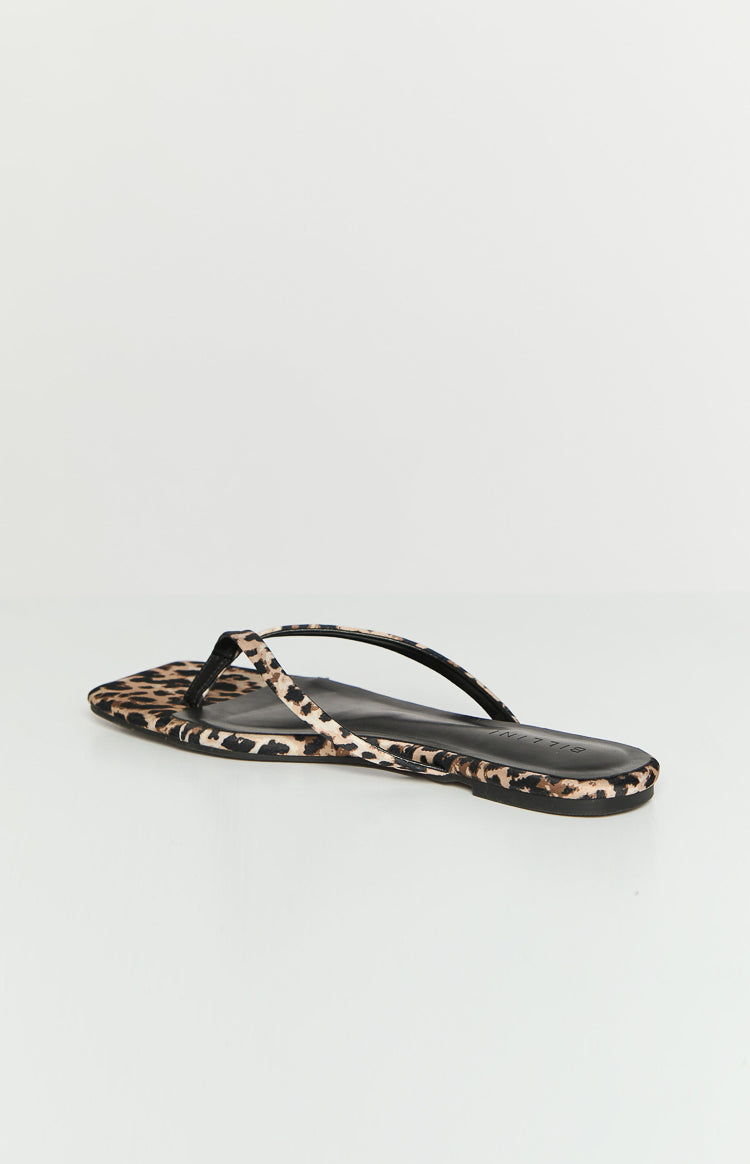 Side view of a leopard print flat with thin black straps and a square toe