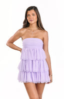 A charming lilac strapless mini dress- designed with a ruched bodice and a layered- ruffled tulle skirt- ideal for a sweet party or homecoming celebration.
