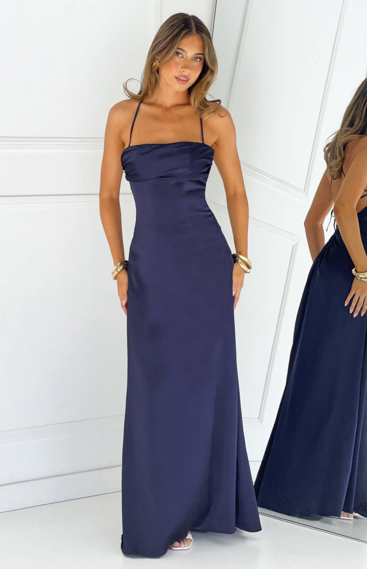 Beginning Boutique Blaise Navy Satin Maxi Dress navy satin maxi dress with a straight neckline, thin spaghetti straps, and a